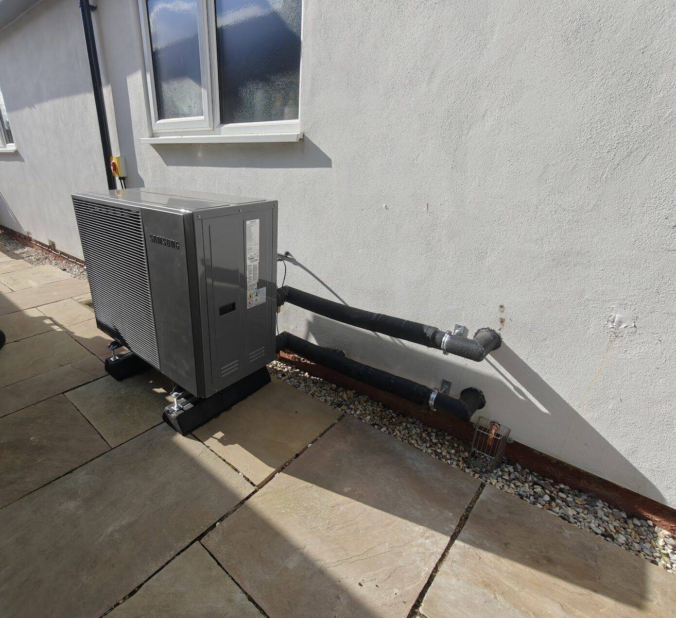 Samsung air source heat pump installation with insulated pipework